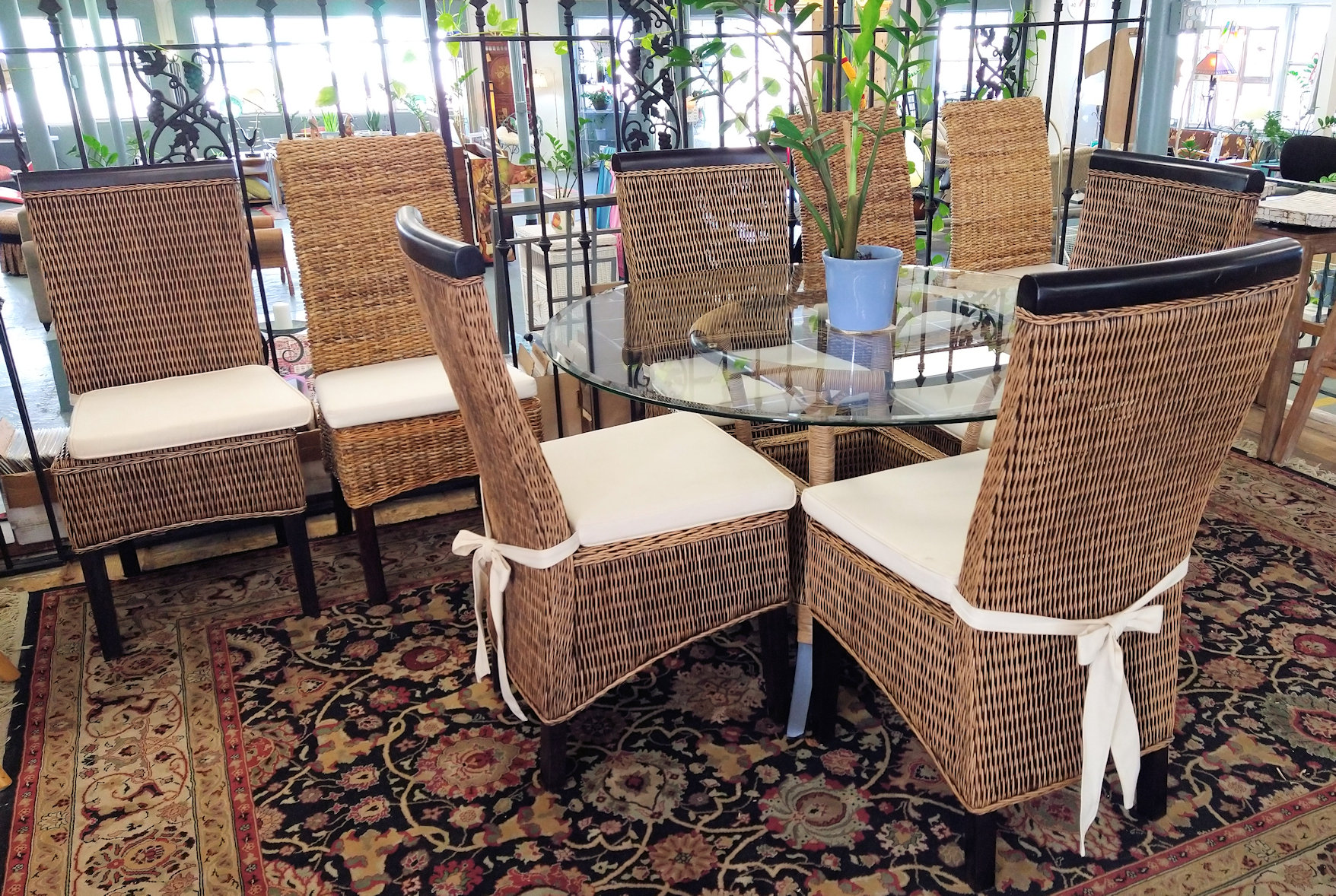 huge glass kitchen table with wicker ped